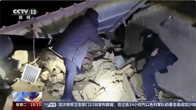 China Quake In this image taken from video footage run by China's CCTV, rescuers work near the rubble from an earthquake in Kizilsu Kirghiz Autonomous Prefecture, China’s western Xinjiang region Tuesday, Jan. 23, 2024. A strong earthquake struck China’s far western Xinjiang region early Tuesday, knocking out power and destroying homes, local authorities and state media reported. (CCTV via AP)