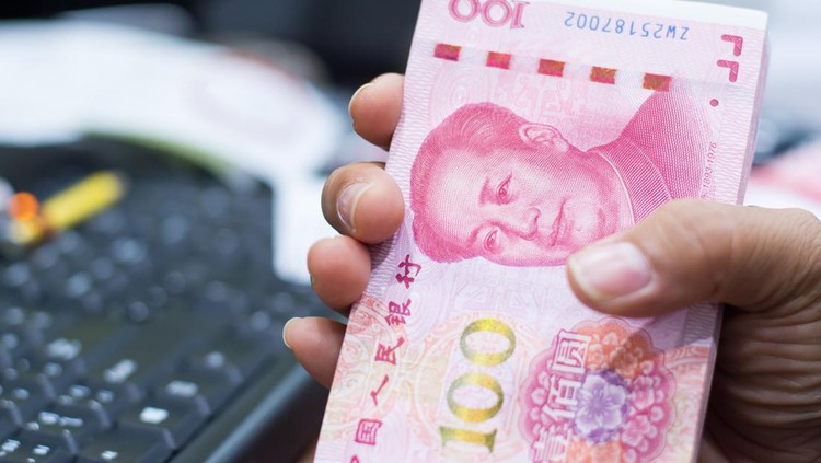 Chinese currency in a hand , Focus on eye of a man on banknote