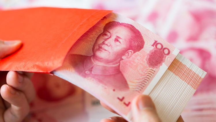 Chinese currency in a hand , Focus on eye of a man on banknote