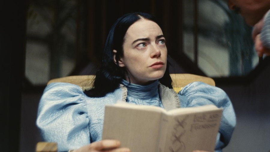 This image released by Searchlight Pictures shows Emma Stone and Yorgos Lanthimo on the set of 
