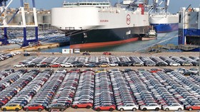 (FILES) This file photo taken on January 10, 2024 shows electric cars for export waiting to be loaded on the "BYD Explorer NO.1", a domestically manufactured vessel intended to export Chinese automobiles, at Yantai port, in eastern China's Shandong p