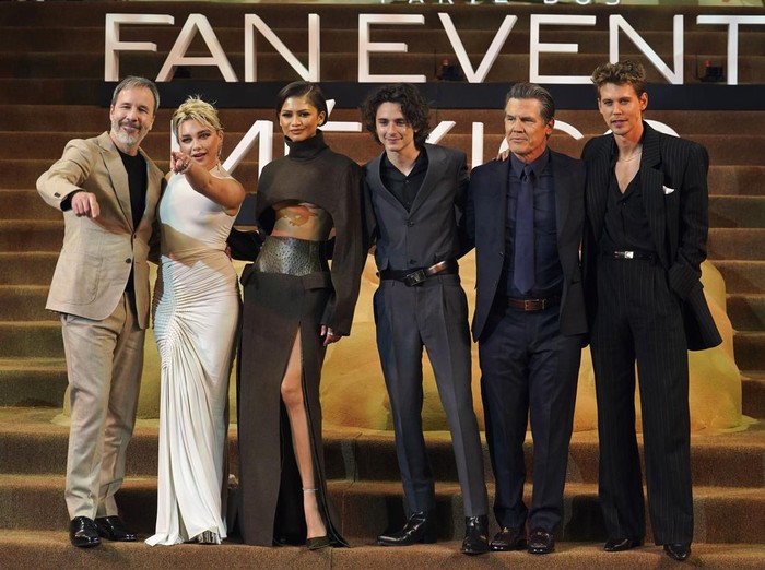 Actor Timothee Chalamet puts on a wrestling mask during a fan event promoting the film, Dune: Part Two, in Mexico City, Tuesday, Feb. 6, 2024. (AP Photo/Marco Ugarte)