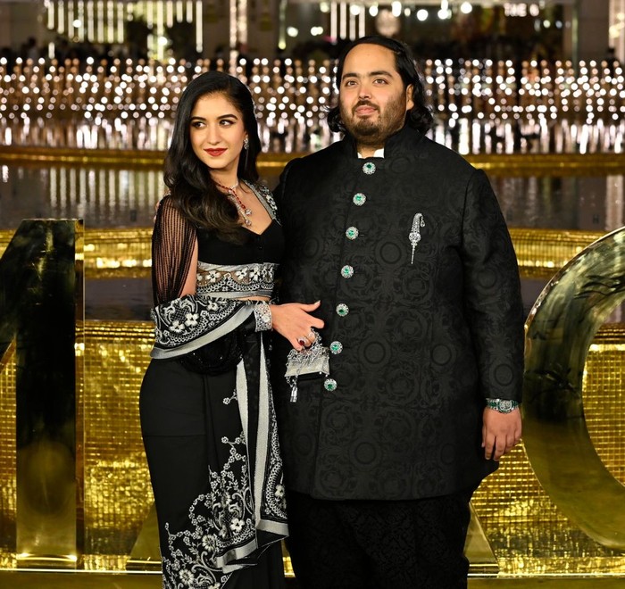 MUMBAI, INDIA - MARCH 31: Anant Ambani with Radhika Merchant during the inauguration of the Nita Mukesh Ambani Cultural Centre (NMACC), at Bandra-Kurla Complex (BKC), Bandra (East), on March 31, 2023 in Mumbai, India. Nita Ambani's dream project, which is housed within the Jio Global Centre in Bandra-Kurla Complex, aims to preserve and promote Indian arts. The event saw the presence of prominent celebrities and businessmen. (Photo by Vijay Bate/Hindustan Times via Getty Images)