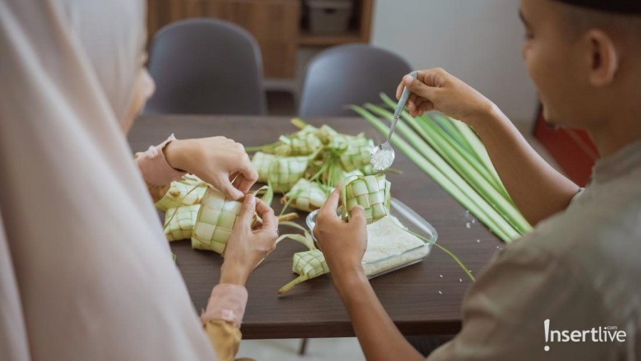 Ketupat Lebaran. Traditional Celebratory Dish of Rice Cake or Ketupat with Various Side Dishes, Popular Served During Eid Celebrations.