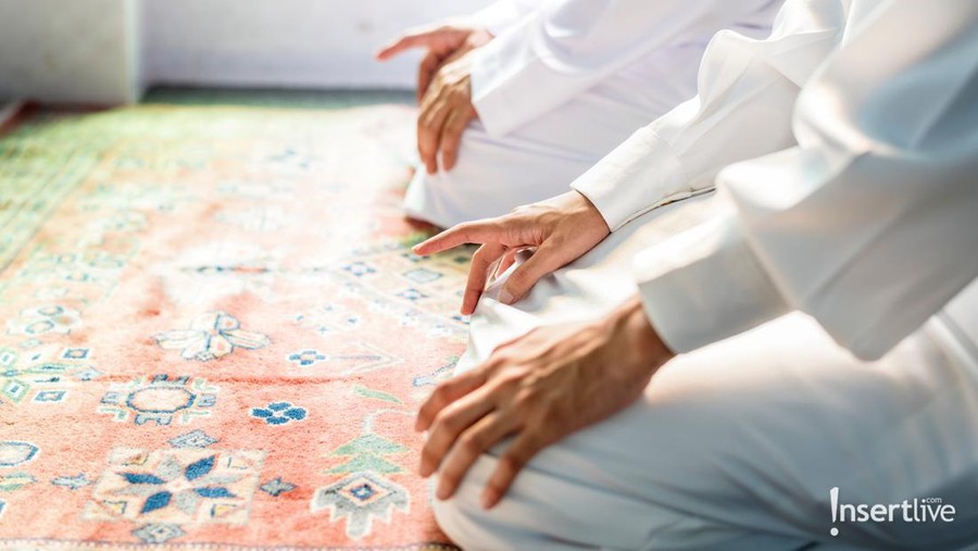 Religious muslim man praying inside the mosque