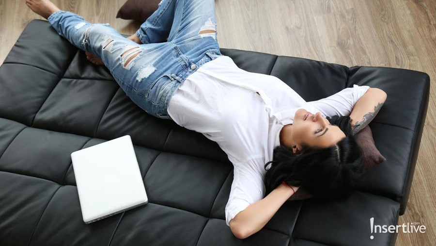 Bored Asian man relaxed and use smartphone for killing time alone in apartment.