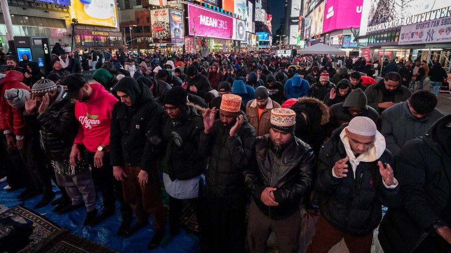 Members of the Muslim community gather for the first Taraweeh prayer of Ramadan in Times Square, New York City, on March 10, 2024. (Photo by Adam Gray / AFP)