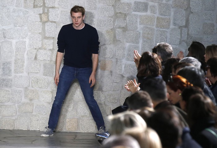 Irish designer Jonathan Anderson acknowledges applauses after Loewe's fall-winter 2015-2016 ready-to-wear fashion collection as part of the Paris Fashion Week, presented in Paris, France, Friday, March 6, 2015. (AP Photo/Michel Euler)