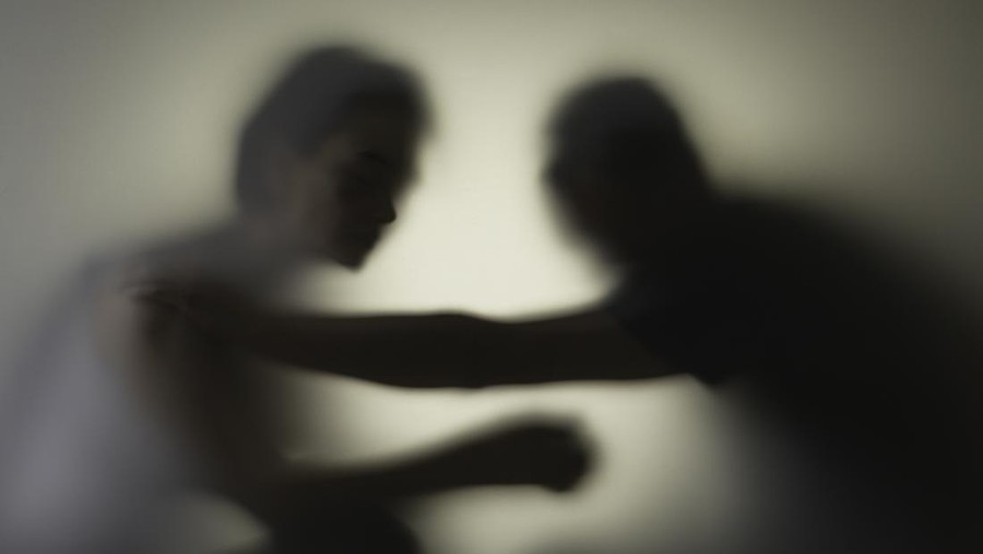 2060736776 Unrecognizable sad woman and man in silhouette. Relationship problems concept.