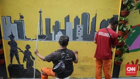 FOTO: Menata Kawasan Pemukiman Warga dengan Mural