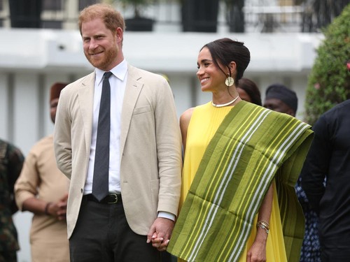 Britain's Prince Harry (2ndR), Duke of Sussex, and  Britain's Meghan (R), Duchess of Sussex, react as Lagos State Governor, Babajide Sanwo-Olu (unseen), gives a speech at the State Governor House in Lagos on May 12, 2024 as they visit Nigeria as part