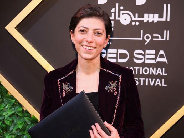 JEDDAH, SAUDI ARABIA - DECEMBER 13: Darin Sallam poses with their Competition Special Mention award for 'Farha' at the closing night Award Ceremony at The Red Sea International Film Festival on December 13, 2021 in Jeddah, Saudi Arabia. (Photo by Tim P. Whitby/Getty Images for The Red Sea International Film Festival)