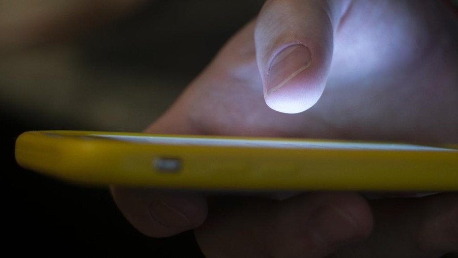 Israel Palestinians Online Protest Explainer FILE - A man uses a cell phone in New Orleans on Aug. 11, 2019. Some social media users are calling out celebrities for what they say is inaction in the face of a humanitarian crisis in Gaza — and they've taken to a