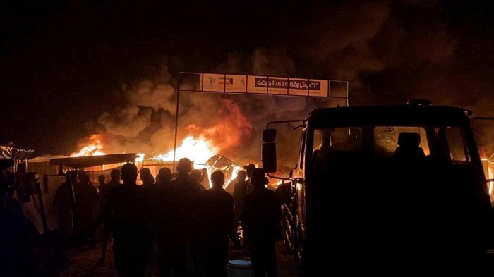 Fire rages following an Israeli strike on an area designated for displaced Palestinians, amid the ongoing conflict between Israel and Hamas, in Rafah in the southern Gaza Strip, in this still picture taken from a video, May 26, 2024. REUTERS/Reuters TV     TPX IMAGES OF THE DAY