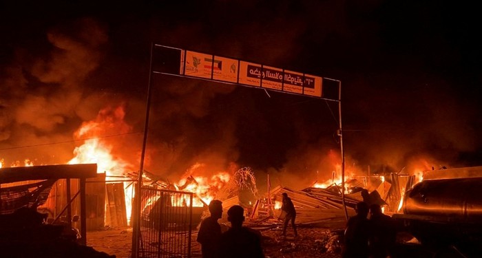 Fire rages following an Israeli strike on an area designated for displaced Palestinians, amid the ongoing conflict between Israel and Hamas, in Rafah in the southern Gaza Strip, in this still picture taken from a video, May 26, 2024. REUTERS/Reuters TV TPX IMAGES OF THE DAY Fire rages following an Israeli strike on an area designated for displaced Palestinians, amid the ongoing conflict between Israel and Hamas, in Rafah in the southern Gaza Strip, in this still picture taken from a video, May 26, 2024. REUTERS/Reuters TV TPX IMAGES OF THE DAY