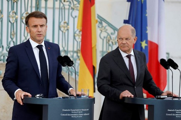 German Chancellor Olaf Scholz (R) and France's President Emmanuel Macron attend a press conference at the Schloss Meseberg palace in Meseberg, eastern Germany, on May 28, 2024. (Photo by Ludovic MARIN / POOL / AFP)