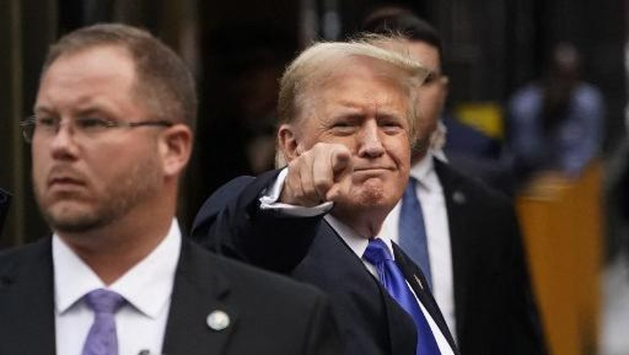 Former US President and Republican presidential candidate Donald Trump points as he arrives back at Trump Tower after being convicted in his criminal trial in New York City, on May 30, 2024. A panel of 12 New Yorkers were unanimous in their determination that Donald Trump is guilty as charged -- but for the impact on his election prospects, the jury is still out. The Republican billionaire was convicted of all 34 charges in New York on May 30, 2024, and now finds himself bidding for a second presidential term unsure if he'll be spending 2025 in the Oval Office, on probation or in jail. (Photo by TIMOTHY A. CLARY / AFP)