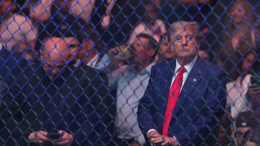 donald trump ufc 302 ufc sean strickland vs paulo costa Jun 1, 2024; Newark, New Jersey, USA; Former president Donald Trump attends the fight between Sean Strickland (red gloves) and Paulo Costa (blue gloves) during UFC 302 at Prudential Center. Mandatory Credit: Joe Camporeale-USA TODAY Sports