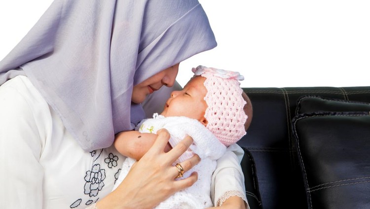 Asian Mother Moslem with her newborn baby girl