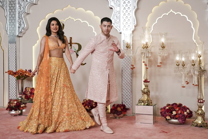 American actor and musician Nick Jonas arrives with his wife Priyanka Chopra at the wedding of Billionaire Mukesh Ambani's son Anant Ambani and Radhika Merchant at Jio World Convention Centre in Mumbai, India, Friday, July 12, 2024. (AP Photo /Rajanish Kakade)