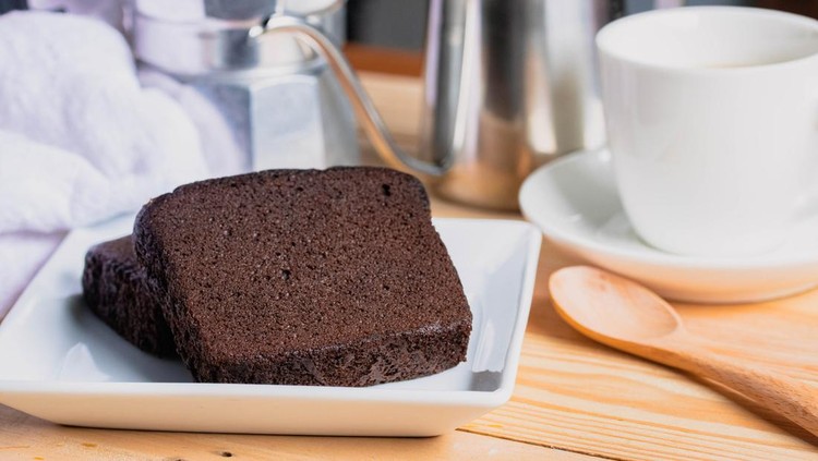 Chocolate cake with coffee in a white plate