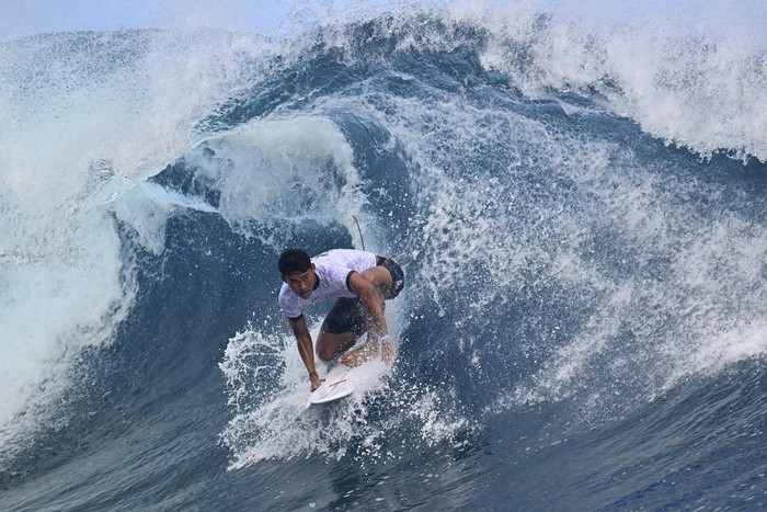 Indonesia's Rio Waida takes part in a surfing training session in Teahupo'o off the French Polynesian Island of Tahiti, Monday, July 22, 2024, ahead of the Paris Olympic Games. (Jerome Brouillet/Pool Photo via AP)