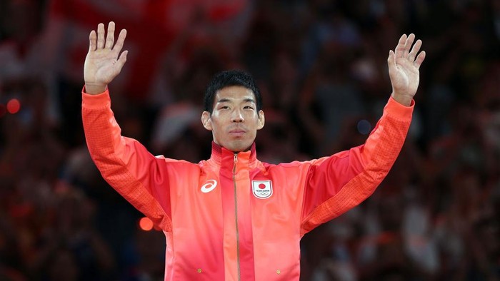 PARIS, FRANCE - JULY 30: Gold medalist Takanori Nagase of Team Japan celebrates on the podium during the Women's Judo Men -81 kg medal ceremony  on day four of the Olympic Games Paris 2024 at Champs-de-Mars Arena on July 30, 2024 in Paris, France. (Photo by Steph Chambers/Getty Images)
