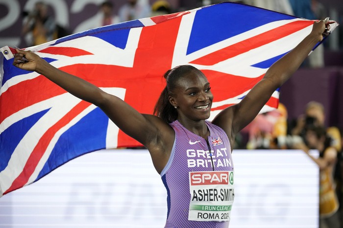 Dina Asher-Smith, of Great Britain, celebrates after winning the gold medal in the women's 100 meters final at the European Athletics Championships in Rome, Sunday, June 9, 2024. (AP Photo/Andrew Medichini)