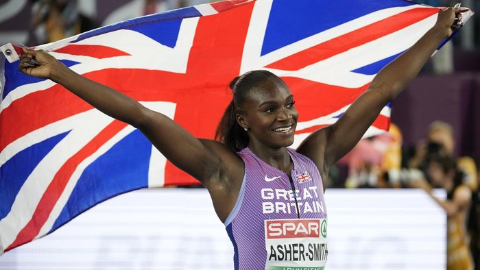 Dina Asher-Smith, of Great Britain, celebrates after winning the gold medal in the women's 100 meters final at the European Athletics Championships in Rome, Sunday, June 9, 2024. (AP Photo/Andrew Medichini)