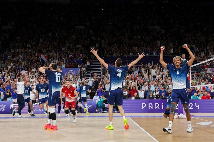 PARIS, FRANCE - AUGUST 7: Barthelemy Chinenyeze #1 of Team France, Jean Patry #4 of Team France, Antoine Brizard #11 of Team France and teammates celebrate the victory of the Men's Semifinals match between Team Italy and Team France on day twelve of the Olympic Games Paris 2024 at Paris Arena on August 7, 2024 in Paris, France. (Photo by Catherine Steenkeste/Getty Images)