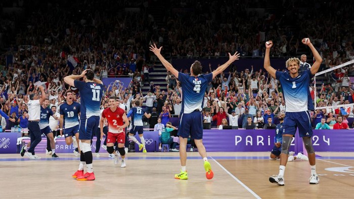 PARIS, FRANCE - AUGUST 7: Barthelemy Chinenyeze #1 of Team France, Jean Patry #4 of Team France, Antoine Brizard #11 of Team France and teammates celebrate the victory of the Men's Semifinals match between Team Italy and Team France on day twelve of the Olympic Games Paris 2024 at Paris Arena on August 7, 2024 in Paris, France. (Photo by Catherine Steenkeste/Getty Images)
