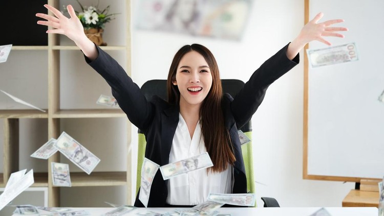 business women hug money on office her, concept for success business and  Financial freedom.