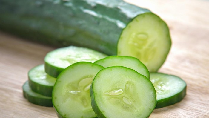 Fresh Cucumber  slices on wood background