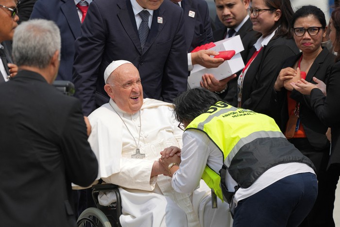 Pope Francis is assisted out of a car ahead of his departure from Jakarta Soekarno-Hatta International Airport, Indonesia, Friday, Sept. 6, 2024. Tatan Syuflana/Pool via REUTERS