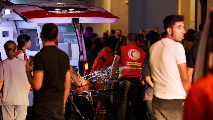 A person is carried on a stretcher outside American University of Beirut Medical Center (AUBMC) as people, including Hezbollah fighters and medics, were wounded and killed when the pagers they use to communicate exploded across Lebanon, according to a security source, in Beirut, Lebanon September 17, 2024. REUTERS/Mohamed Azakir Purchase Licensing Rights