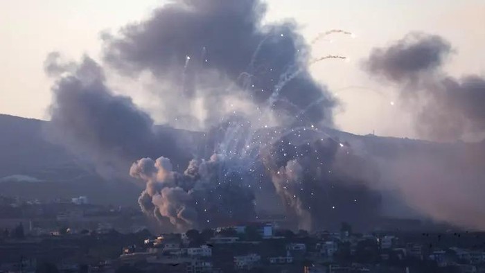 Smoke billows over southern Lebanon following Israeli strikes, as seen from Tyre, southern Lebanon September 23, 2024. (Reuters)