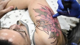 FOTO: Tato Artistik Goresan Seniman di Pameran Tato Internasional