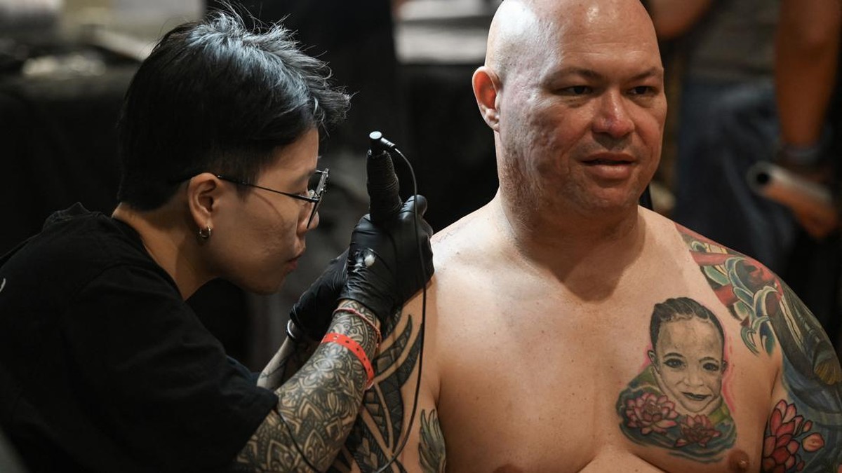 FOTO: Tato Artistik Goresan Seniman di Pameran Tato Internasional