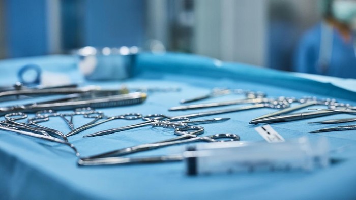 Close-up of surgical instruments on tray in operating room. Medical equipment on table in emergency room. It is at animal hospital