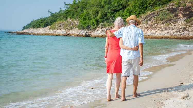 Mature couple have fun together on the beach, Lifestyle, Love and weekend.