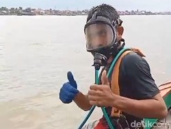 Bertaruh Nyawa di Kegelapan Dasar Sungai Musi