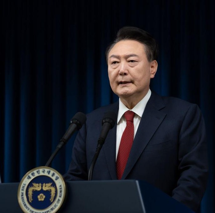 SEOUL, SOUTH KOREA - DECEMBER 07: (EDITOR’S NOTE: This Handout imagewas provided by a third-party organization and may not adhere to Getty Images’ editorial policy.) In this handout photo provided by the South Korean Presidential Office, South Korean President Yoon Suk-Yeol speaks to the nation at the Presidential Office on December 07, 2024 in Seoul, South Korea. South Korea is facing significant political turmoil after President Yoon Suk-yeol declared emergency martial law, accusing opposition parties of destabilizing governance and sympathizing with North Korea. His controversial move, since rescinded after a 190-0 vote by lawmakers condemning the move, has sparked widespread criticism, calls for Yoon's resignation, and raised concerns about the implications for democracy in the country. (Photo by South Korean Presidential Office via Getty Images)