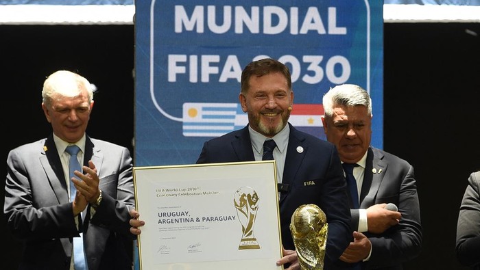 CONMEBOL President Paraguayan Alejandro Dominguez holds a certificate ratifying Argentina, Paraguay, and Uruguay as host countries of the FIFA 2030 World Cup during the FIFA virtual Congress in Luque, Paraguay, on December 11, 2024. A virtual Congres