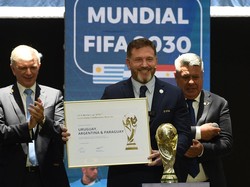 CONMEBOL President Paraguayan Alejandro Dominguez holds a certificate ratifying Argentina, Paraguay, and Uruguay as host countries of the FIFA 2030 World Cup during the FIFA virtual Congress in Luque, Paraguay, on December 11, 2024. A virtual Congres