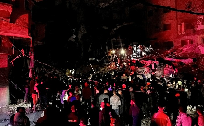 A person is placed inside an ambulance following an Israeli strike at a post office where people were sheltering in Nuseirat in central Gaza Strip December 12, 2024. REUTERS/Khamis Said