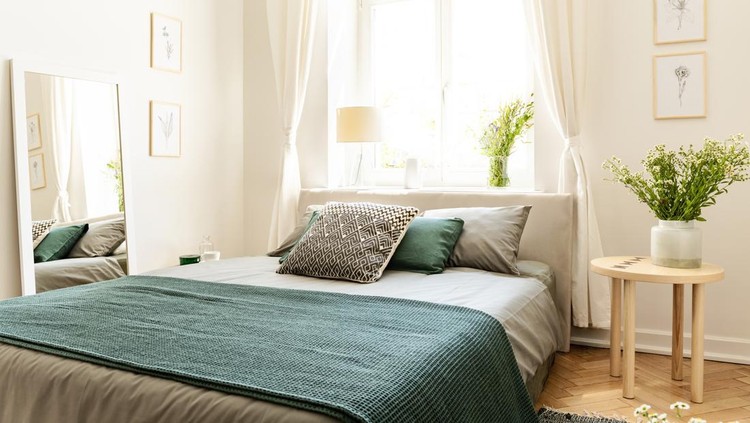 Eco cotton linen and blanket on a bed in nature loving family guesthouse for spring and summer vacation&period; Real photo&period;