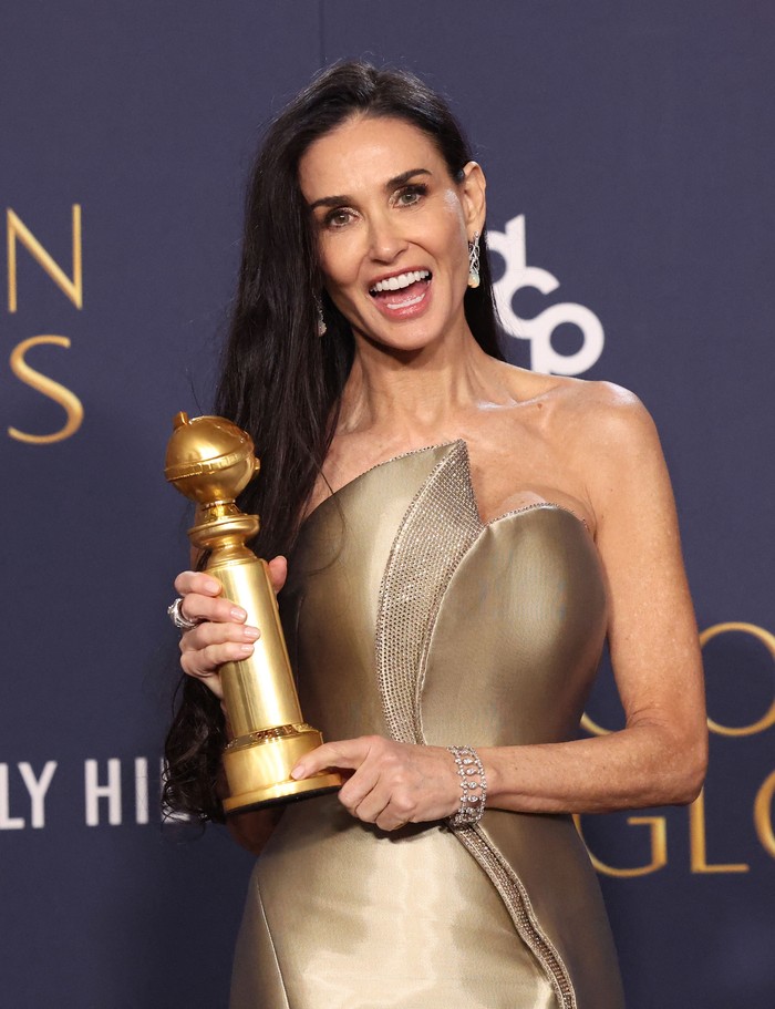 Demi Moore poses with the award for Best Performance by an Actress in a Motion Picture - Musical or Comedy, for The Substance, at the 82nd Golden Globe Awards in Beverly Hills, California, U.S., January 5, 2025. REUTERS/Mario Anzuoni     TPX IMAGES OF THE DAY
