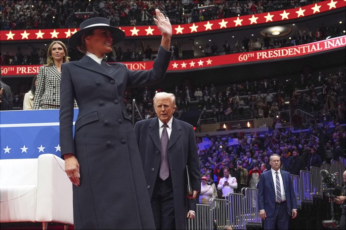 President Donald Trump and first lady Melania Trump arrive at an indoor Presidential Inauguration parade event at Capital One Arena, Monday, Jan. 20, 2025, in Washington. (AP Photo/Evan Vucci)
