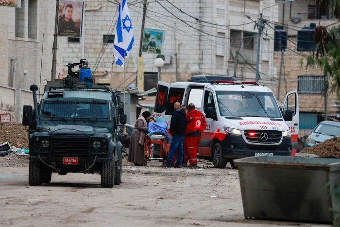 Tamer Abu Zaho, who tried to deliver bread, medicines and diapers to his mother, who is trapped inside a Jenin hospital amid an Israeli raid, stands, in the Israeli-occupied West Bank, January 22, 2025. REUTERS/Ammar Awad