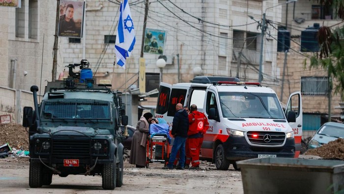 Tamer Abu Zaho, who tried to deliver bread, medicines and diapers to his mother, who is trapped inside a Jenin hospital amid an Israeli raid, stands, in the Israeli-occupied West Bank, January 22, 2025. REUTERS/Ammar Awad